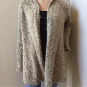 Sleeping on snow fuzzy cardigan